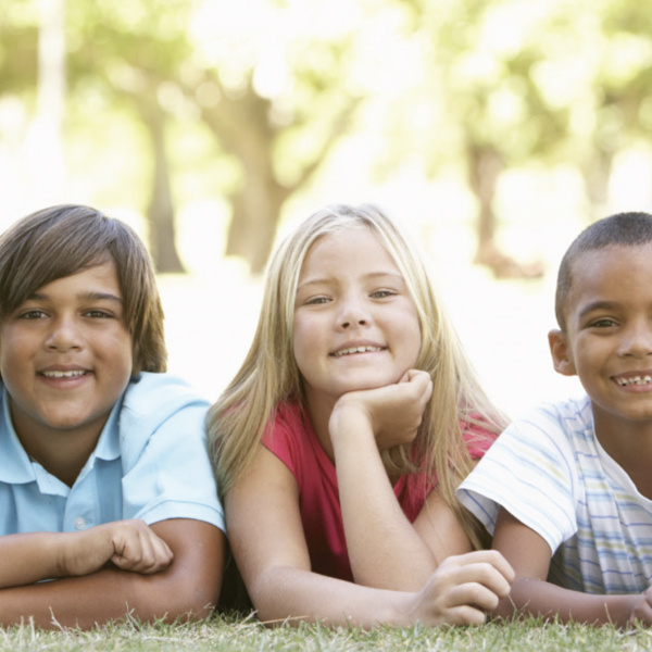 Happy children posing for a photo outdoors.
