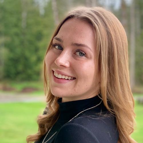 Female CYC student outside.